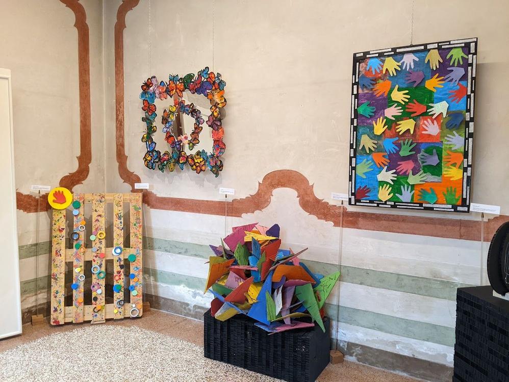 Caption: A photo showing several colorful art pieces created by children and displayed at the Biennale Of Children's Art. (Local Guide @ErmesT)