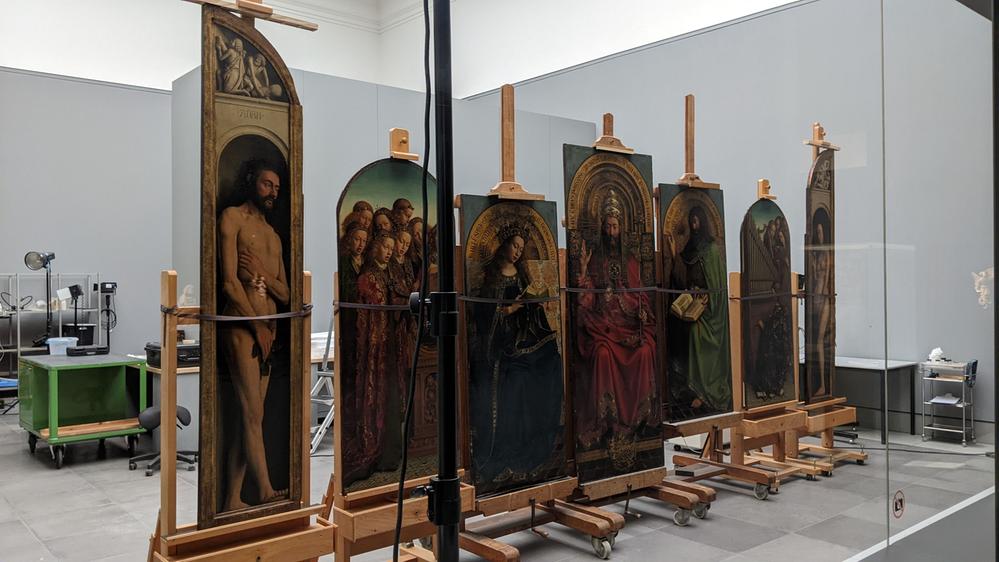 Caption: A photo showing the top part of the 15th-century painting ‘The Ghent Altarpiece’ propped up on easels for restoration at the Museum of Fine Arts. (Local Guide @JanVanHaver)
