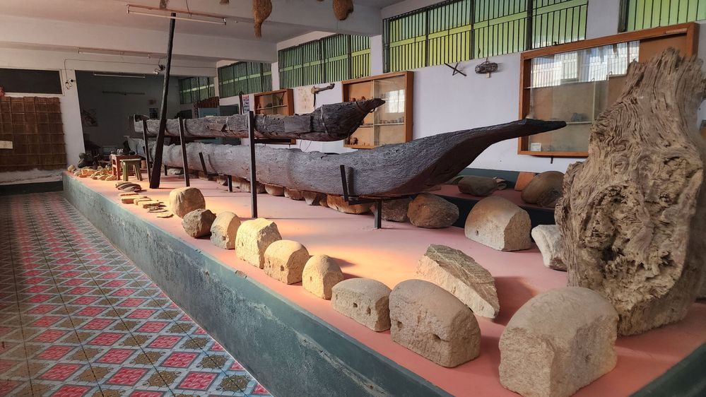 Caption: A photo showing rocks of different shapes and origins and two 300-year-old wooden boats on display at the Panchagarh Rocks Museum. (Local Guide @SanjayBDLG)