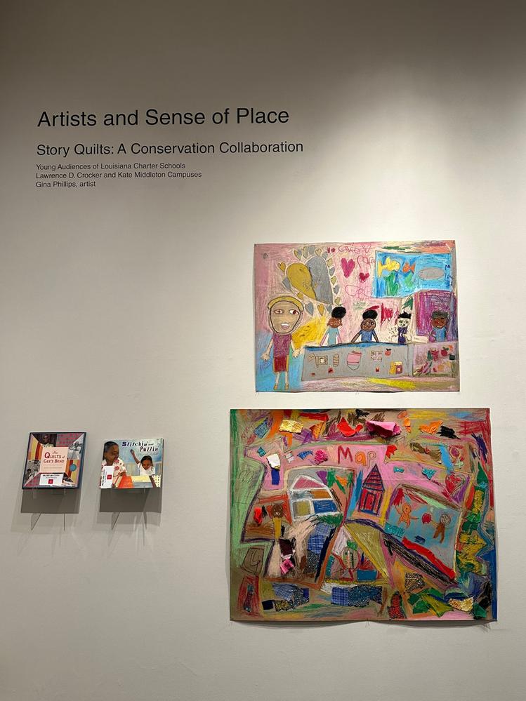 Caption: A photo showing curated art by children at the Ogden Museum of Southern Art and a text on the wall saying, “Artists and Sense of Place.” (Local Guide @TiffanyStockstill)