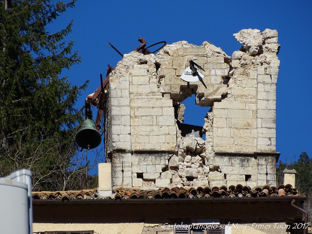 Caption: A bell tower devastated by the 2016 earthquake.