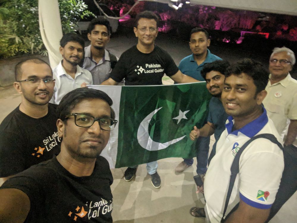 Caption: A selfie of @IlankovanT, Kashif — who’s holding the Pakistani flag — and other Local Guides from Pakistan and Sri Lanka during an accessibility meet-up in Sri Lanka. (Courtesy of Local Guide @KashifMisidia)