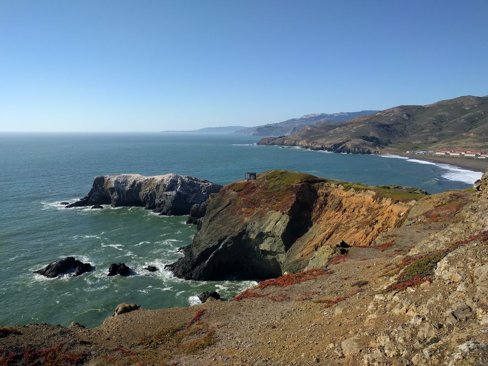 A photo of the rocky coast of the Pacific Ocean from the Marin Headlands in the San Francisco Bay Area.