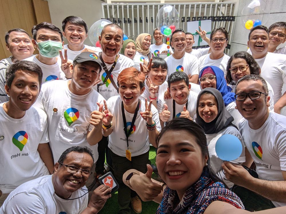 Caption: A photo of Jakarta Local Guides wearing Google Maps t-shirts and a Google representative during the Maps’ birthday meet-up that Devi hosted. (Courtesy of Local Guide @Ddimitra)