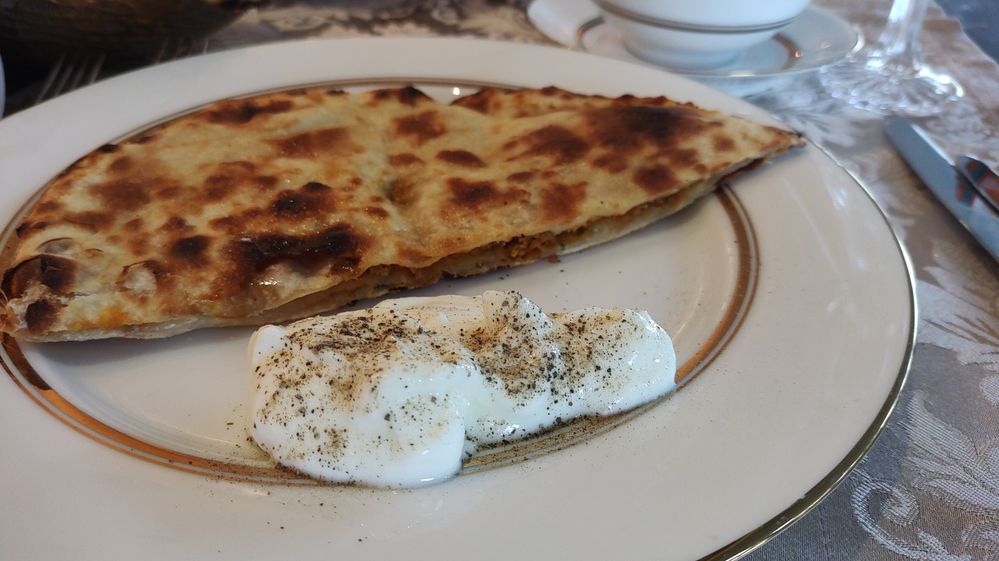Amritsari Kulcha with Chilled Curd with Black Pepper .