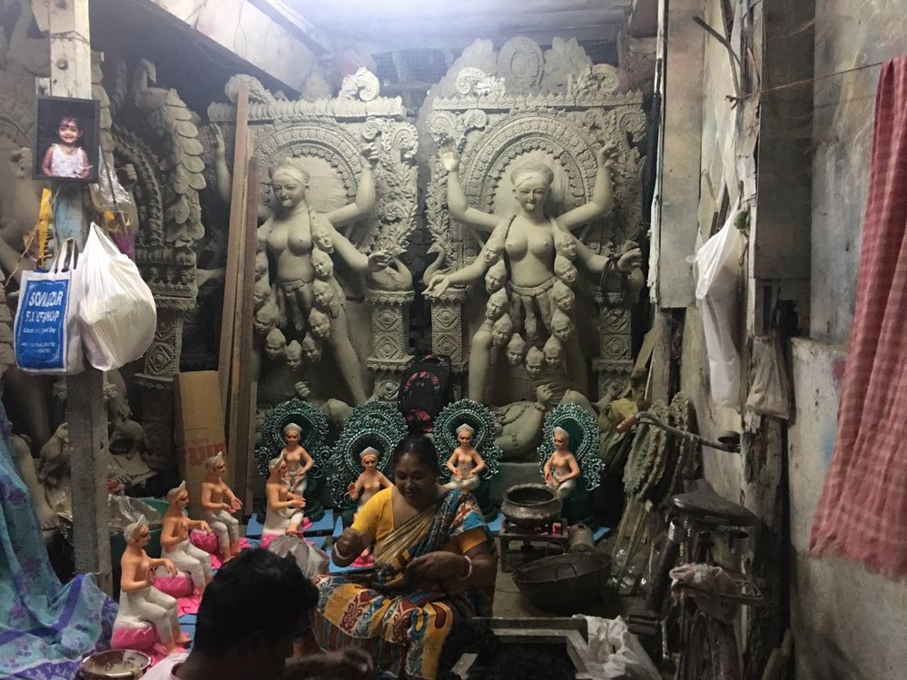 Caption: Durga idols being handpainted