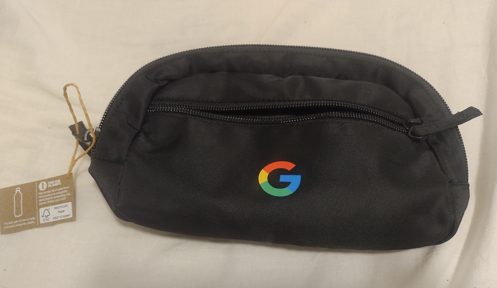 A super G Eco Belt Bag - a black bag with a G from Google in the front