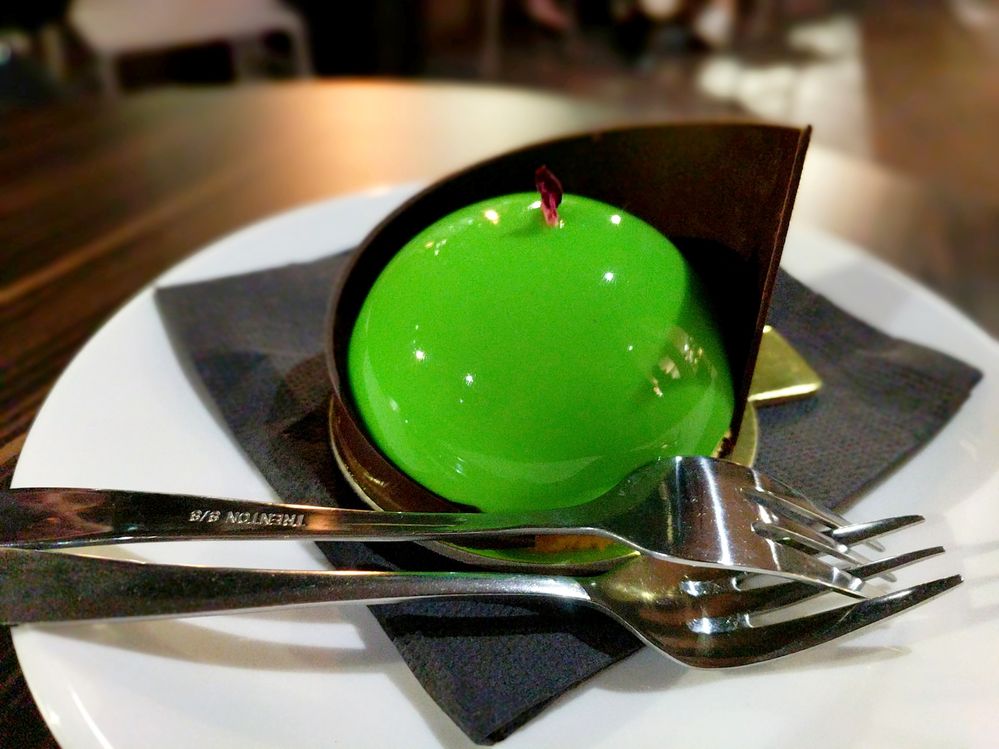 A sweet green perfect sour apple with a cape of dark chocolate.