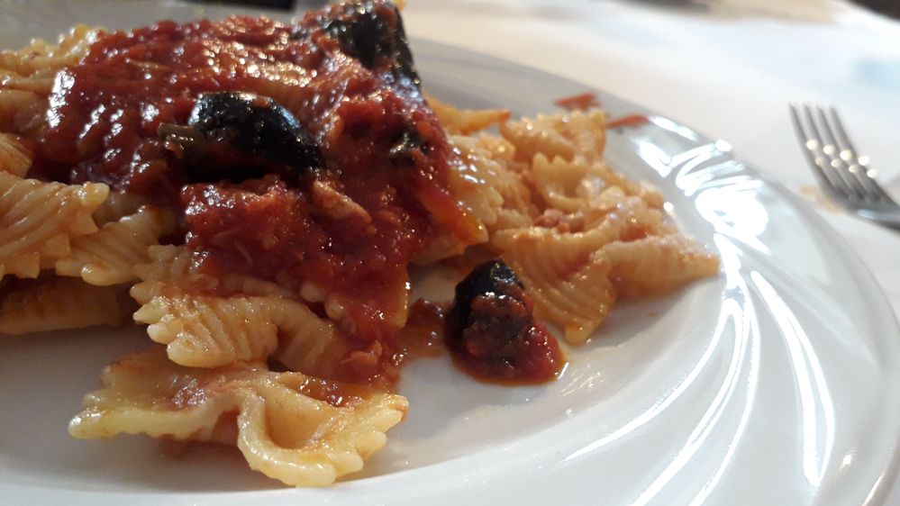 Butterfly pasta with tuna,tomato and black olives