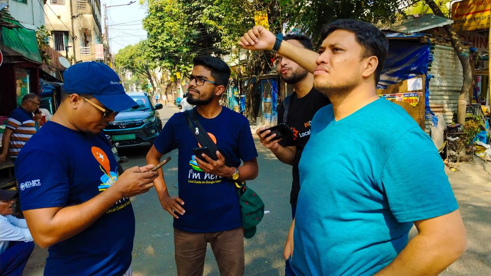 Local Guides from Bangladesh being guided by local boy Pritish on the streets of Kolkata, India