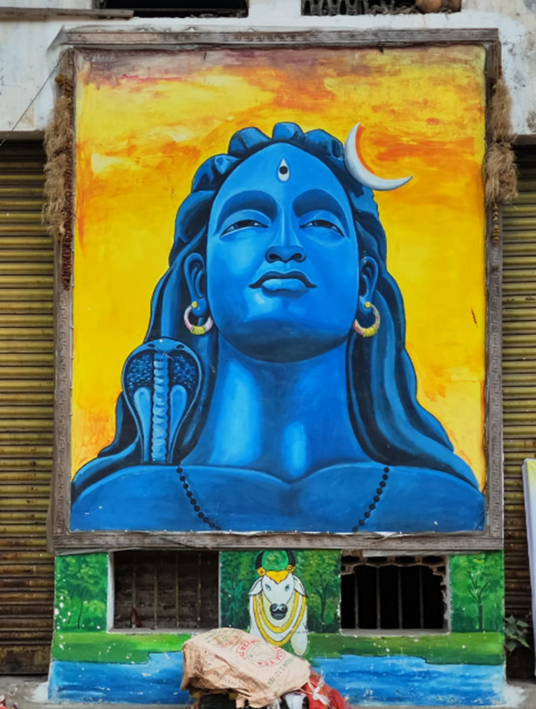 Caption: Street art Painting of Lord Shiva on the wall