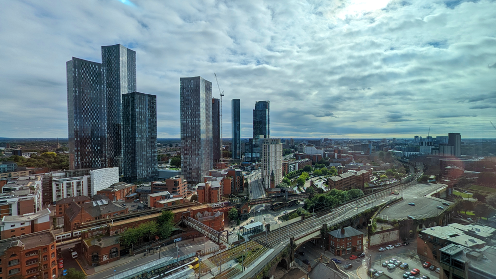 Caption: Manchester's modern and magnificent skyline, showing a mix of ancient and modern, as history and high tech dwell side by side.