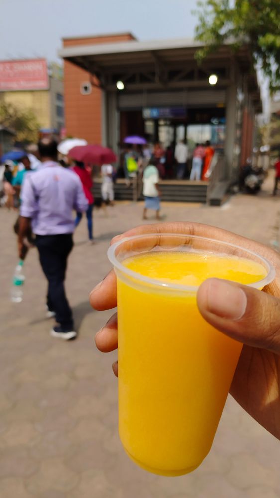 A sip of Mango Juice at Howrah Maidan metro station