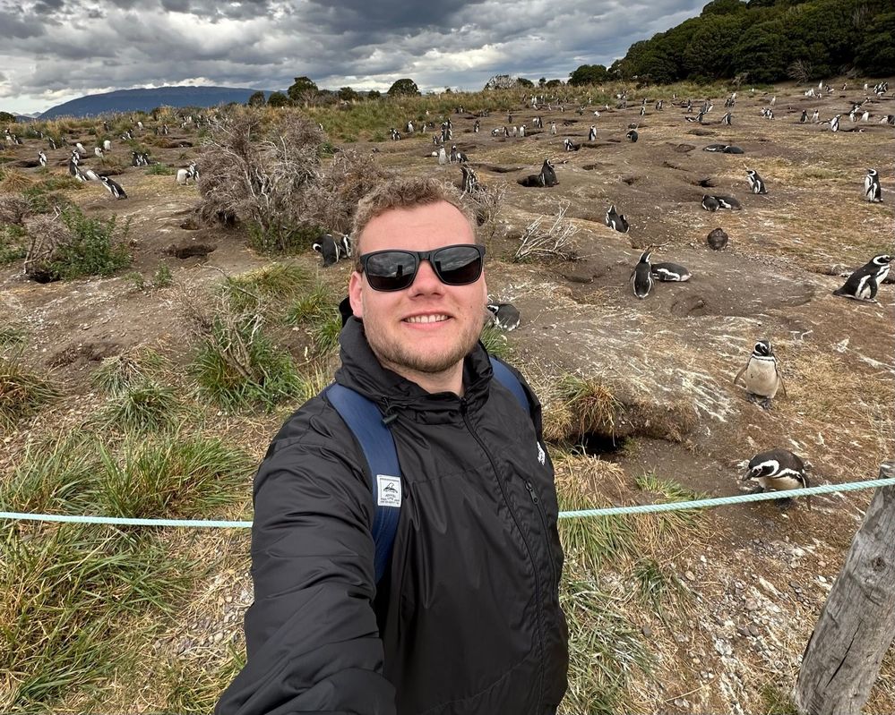 Caption: A photo of Lucas taking a selfie with some penguins on Isla Martillo, Tierra del Fuego, Argentina. (Local Guide @Lukelhm)