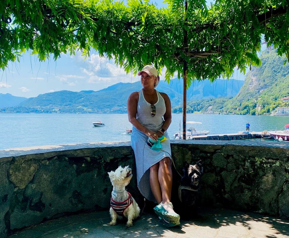 Caption: A photo of Local Guide Barking Mice with Donder (left) and Dingus (right) at Lake Como in Italy. (Courtesy of Local Guide @BarkingMice)