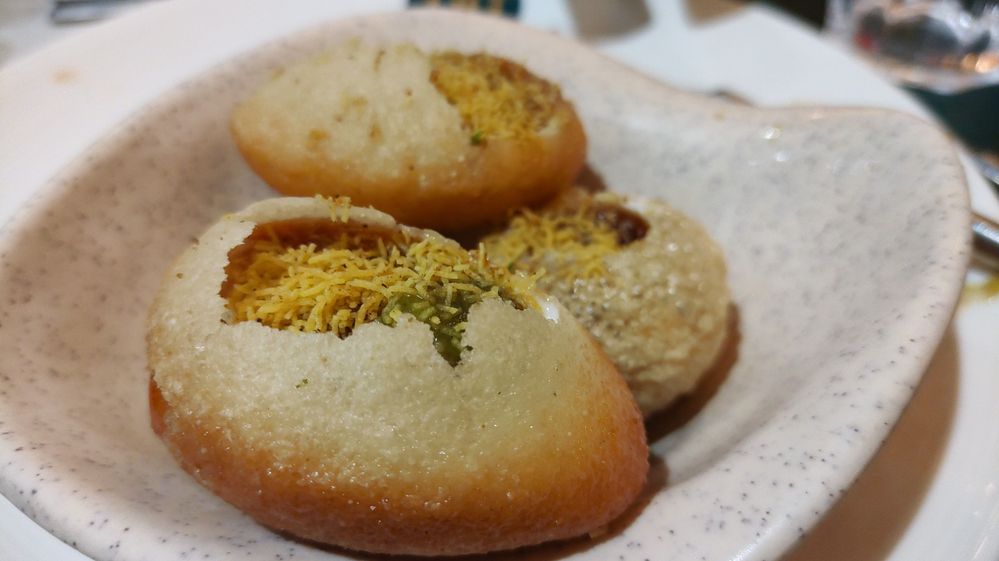 Indian Street Food - Dahi Puri - The mix of Yoghurt and sauces in the fried wheat balls (puri)!