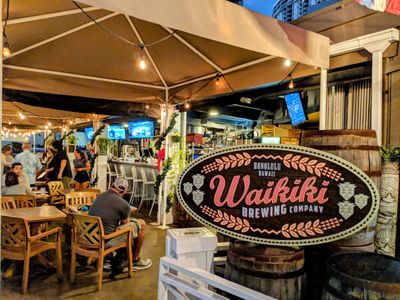 Caption: Entry to the Waikiki Brewing Co. patio bar by JustJake