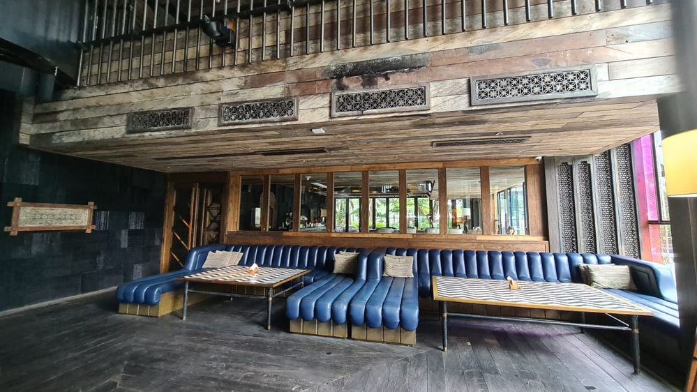 Caption : A photo of the long blue couches inside Caspar, Jakarta. (Local Guide @Velvel)