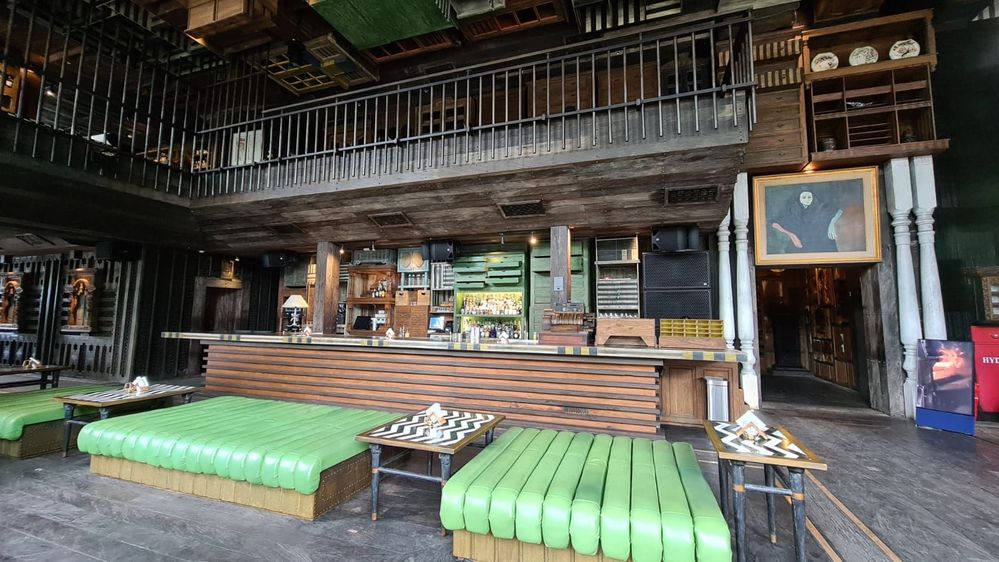 Caption : A photo of  the long green couches inside Caspar, Jakarta. (Local Guide @Velvel)