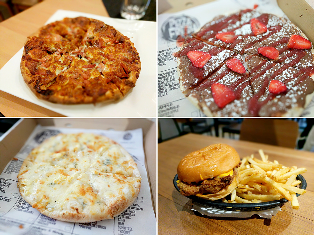 From Top-Left to Bottom-Right: One scrumptious meaty pizza for a main, one Nutella pizza with some strawberries for a dessert, one garlic pizza for an entree, and a Southern-fried chicken burger with some chips! Check them apples!