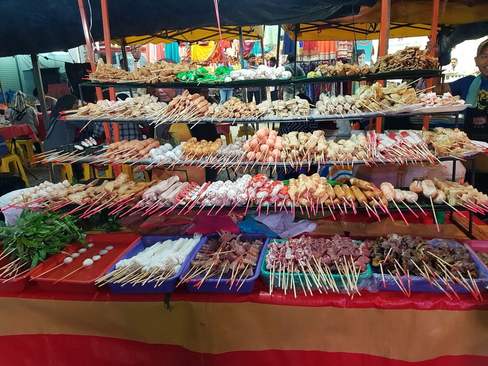 Malaysian local hotpot skewers: Satay Celup. Self service, pick your own skewers, dip them in hot broth for cooking and enjoy with chilly sauce.