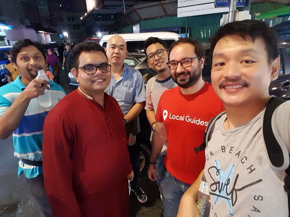 Malaysia Local Guides walking through the night market