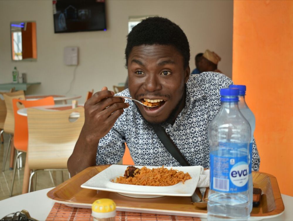 Dayo Looking Excited enjoying Nigerian Jollof