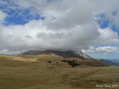 Caption: Vettore mountain surrounded by clouds