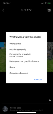 Select photo, click flag in bottom right corner and report as "Wrong Place"