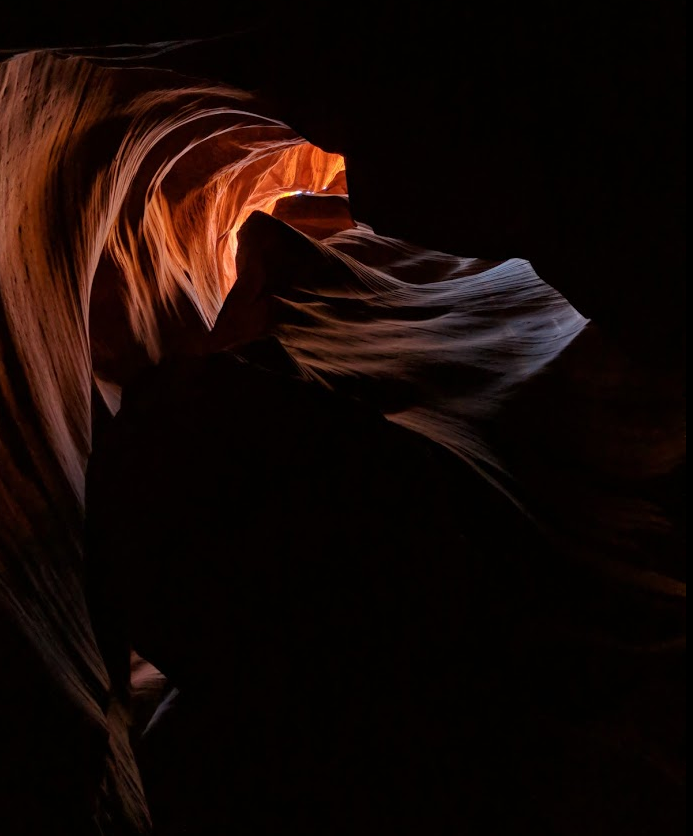 Caption: Looking up in a narrow opening of the canyon