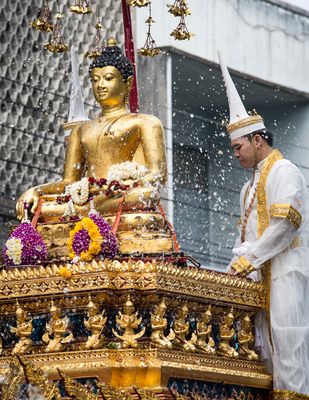 Buddha statue being bathed in the parade