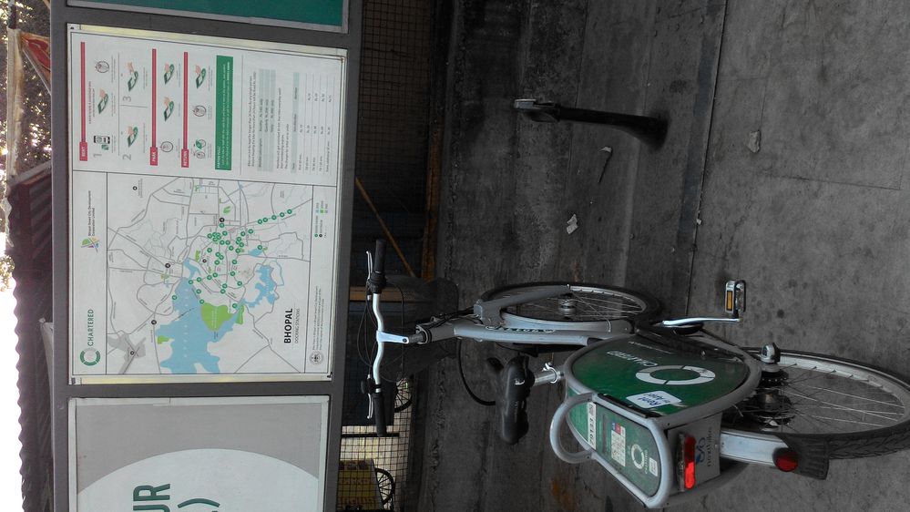 Bicycle with map showing docking stations