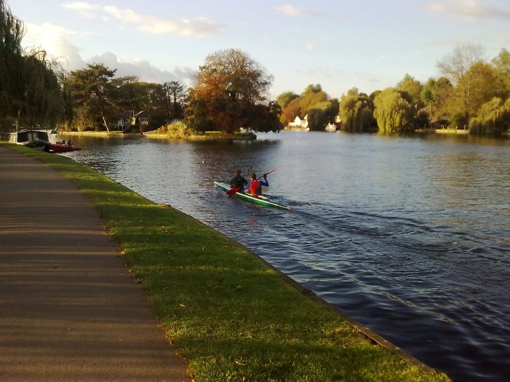 Rowers go about their daily practice. The narrow path along the stretch makes for a lovely walk.