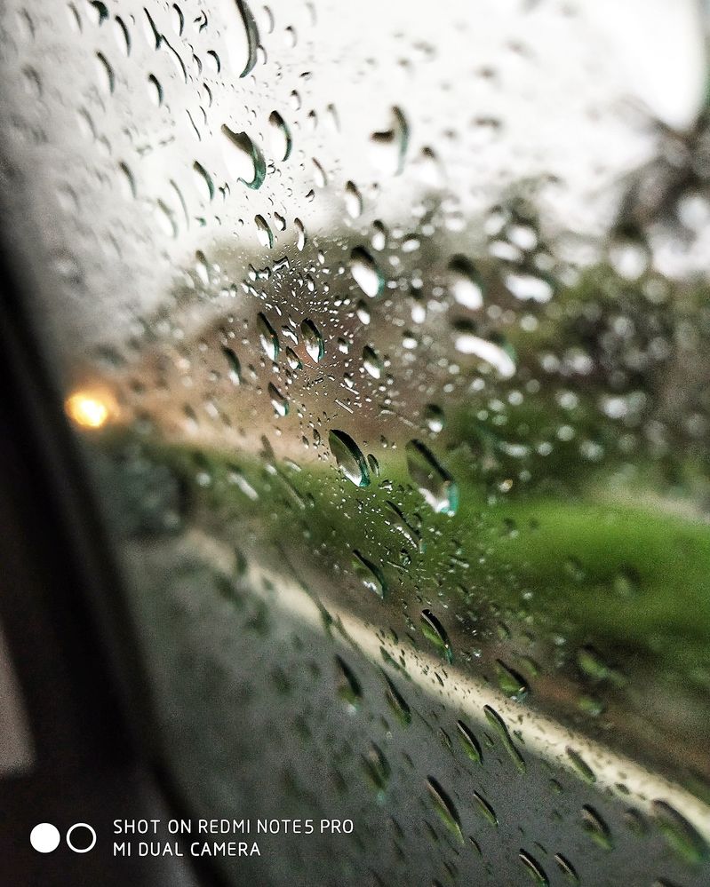 When the drops stick to the window of the car. i took this shot with my Redmi Note 5 pro phone.