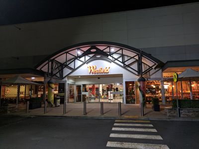 Caption: Night time picture of the entrance of Westfield Mount Druitt.