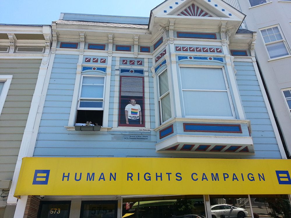 Caption: A photo of a painting of Harvey Milk on the window of what is now the Human Rights Campaign Store. (Local Guide Rene Rivera)