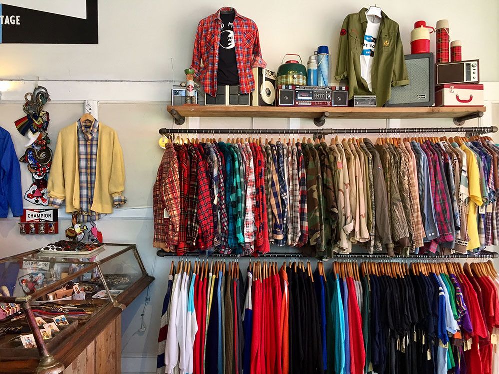 Caption: A photo of a display case and shirts hanging in a vintage clothing store. (Local Guide Juliana Thomas)