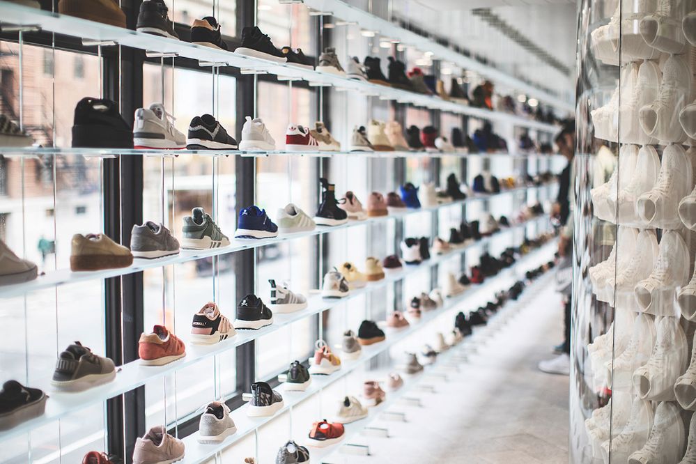 Caption: A photo of a variety of sneakers in a window on display shelving. (Local Guide Kenneth Nguyen)