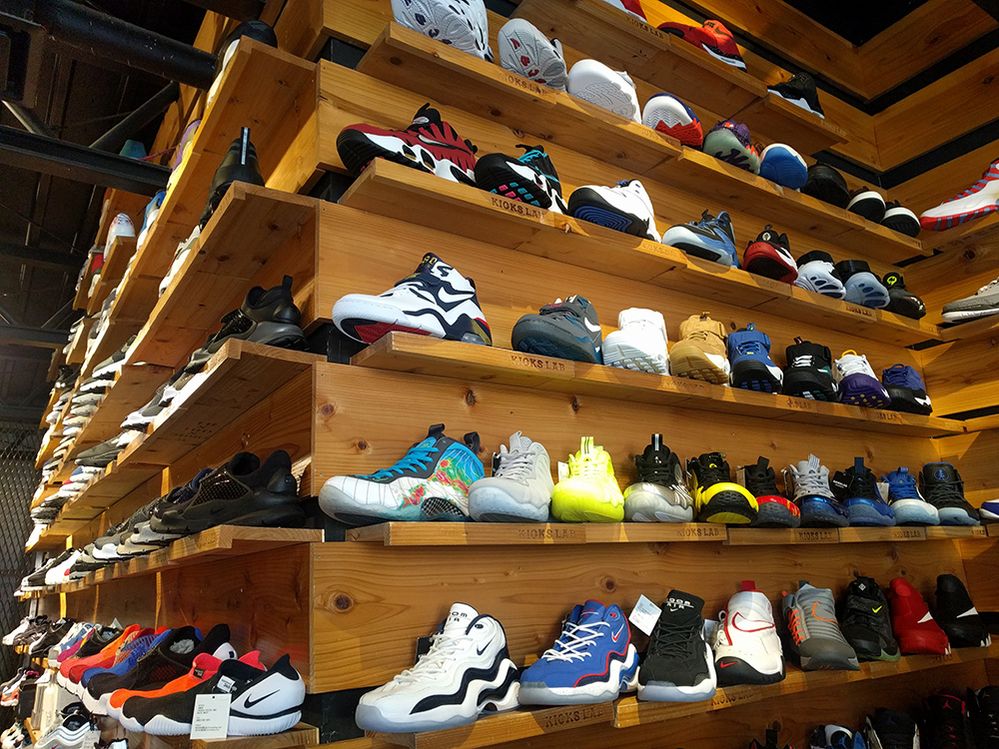 Caption: A photo of sneakers on shelves at Kicks Lab in Tokyo. (Local Guide Koubran Tetteh)