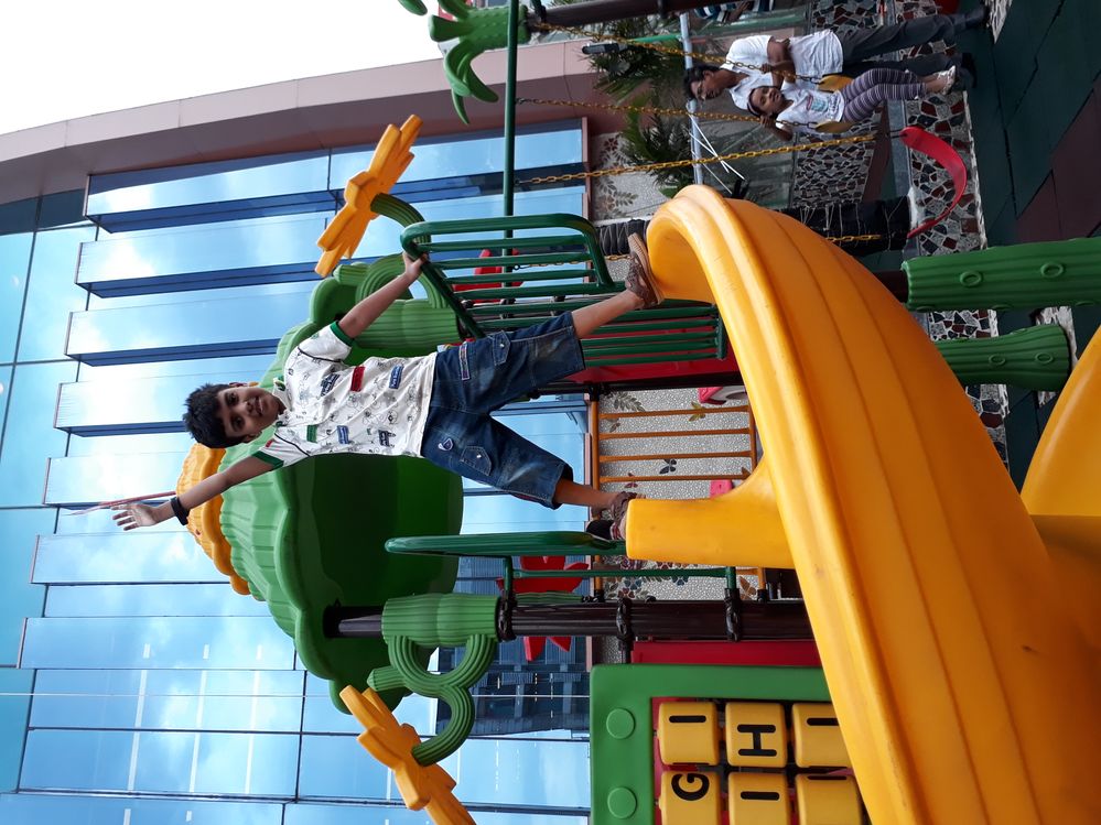 Playing at the kid's zone in Zam Zam Tower, Uttara, Dhaka, Bangladesh.