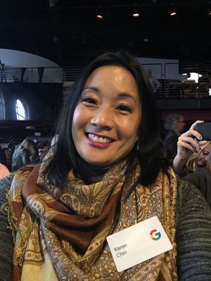 Caption: A photo of Karen smiling at a Google event.