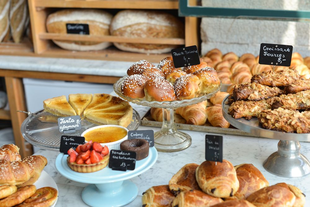 Caption: A photo of a variety of baked goods on display at Charlotte, a French bistro in Kraków, Poland. (Local Guide Paweł Kowalik)