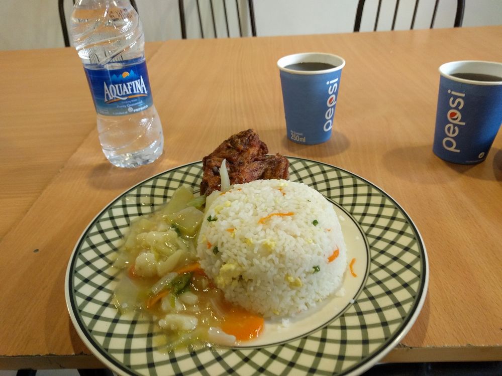 Lunch menu. Rice, chicken and vegetable  with  a glass of cold drinks.