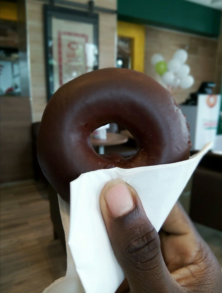 Me Holding A Chocolate Glazed Donughts