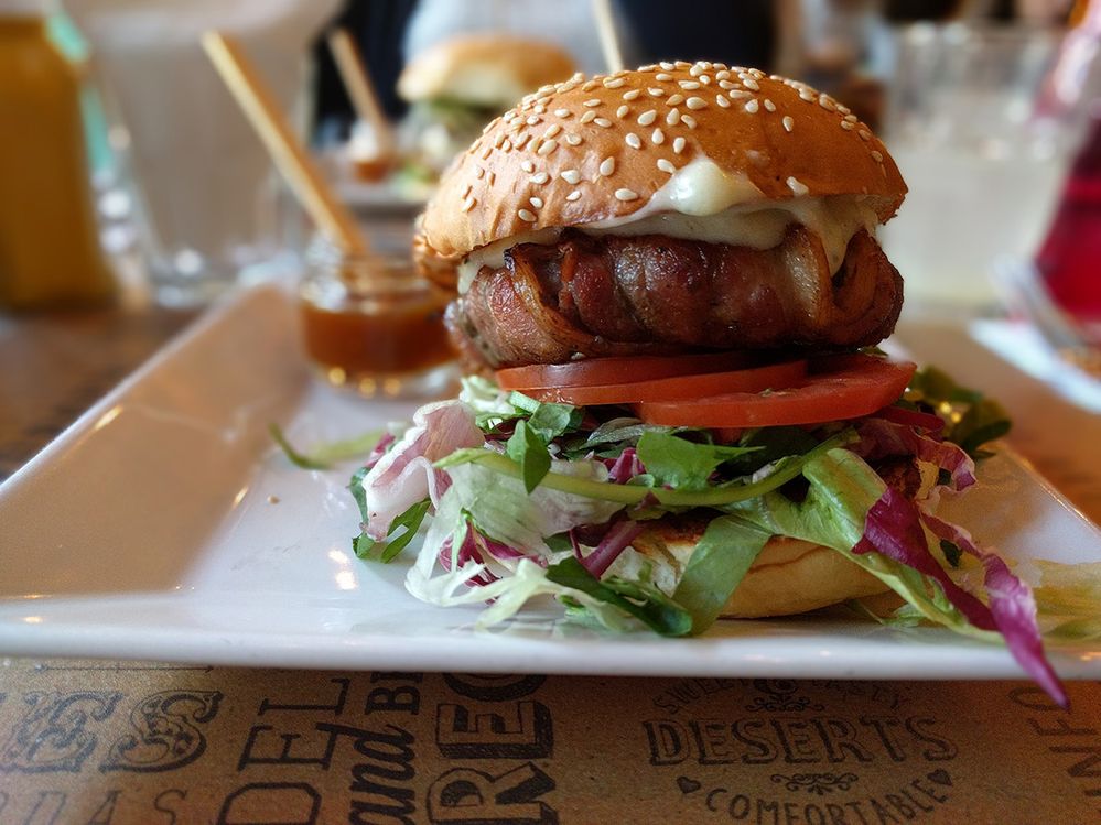Caption: A photo of a  bacon cheeseburger on a plate at Beach Burger in Sao Paolo, Brazil. (Local Guide Ricardo Takatu)