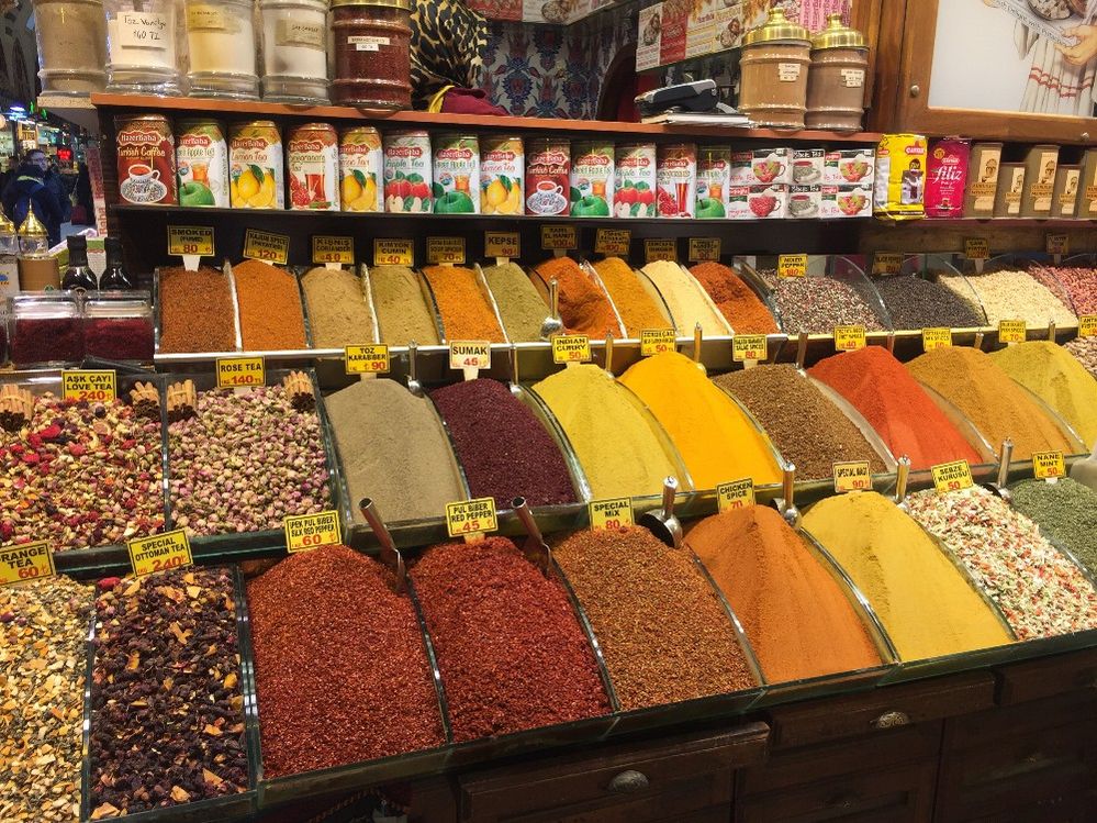 Caption: A photo of various colorful spices and tea piled high in bins at a stall at the Spice Bazaar in Istanbul, Turkey. (Local Guide Vasya Konovalov)