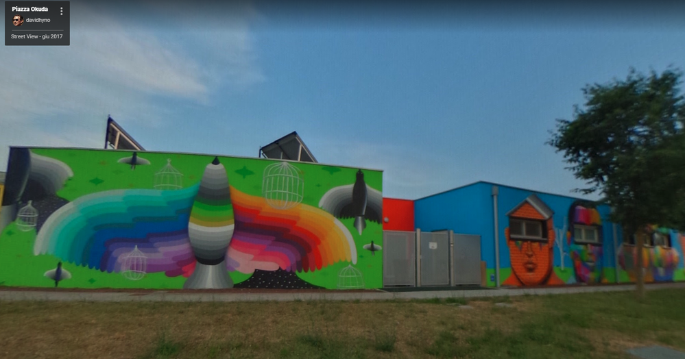 Murals on the walls of a school by Okuda
