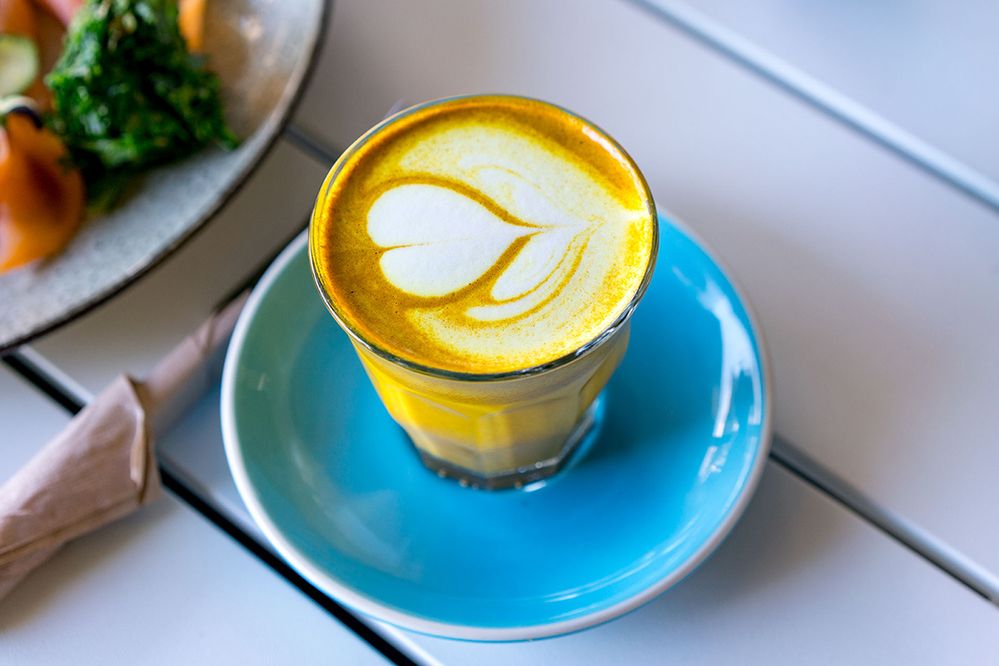 Caption: A photo of a coffee drink with a heart design made using the foam at Simplicity Cafe in Sydney, Australia. (Local Guide Paul Hinderer)