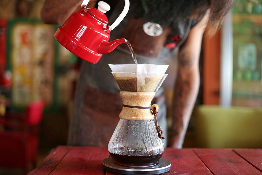 Caption: A closeup photo of a barista making pour over coffee. (Getty Images)