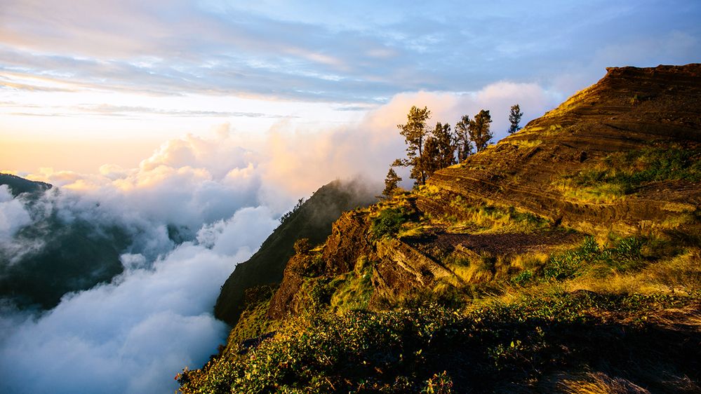 Caption: A photo of a mountain and clouds before sunset at Rinjani Base Camp in Lombok Island, Indonesia. (Getty Images)